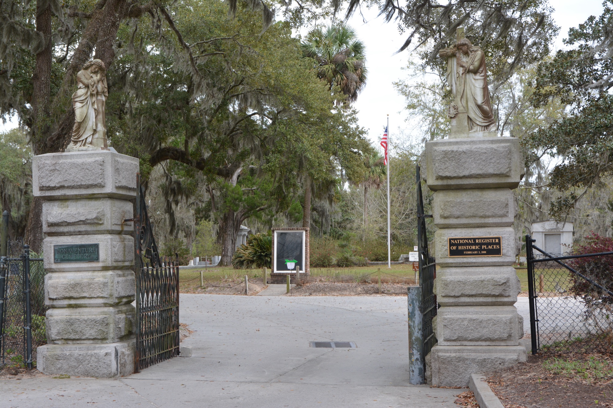 The historic entrance gate to Bonaventure Cemetery under live oaks and Spanish moss in Savannah