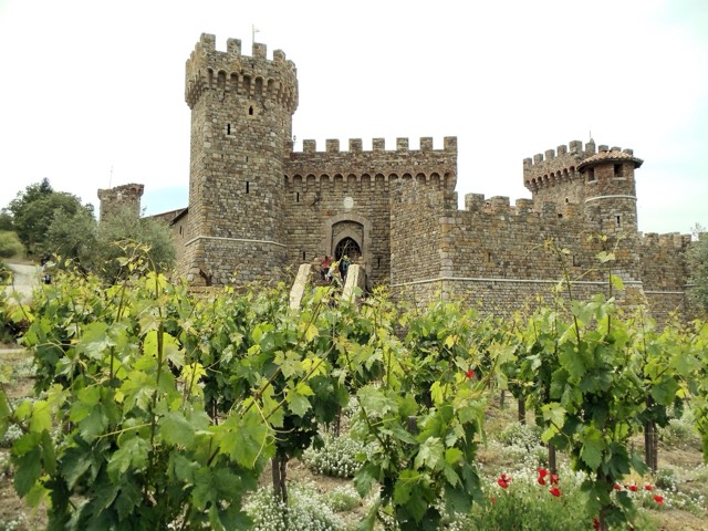 The medieval Tuscan-style stone castle winery of Castello di Amorosa rising above its Napa Valley vineyards