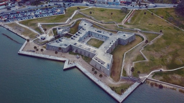 An aerial view of the star-shaped stone Castillo de San Marcos on Matanzas Bay in St. Augustine, showing its four-pointed bastion geometry
