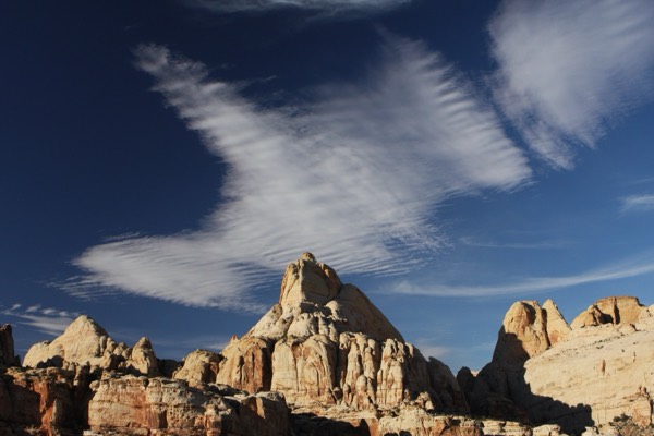 The view from Cohab Canyon toward a Capitol dome under a dramatic sky