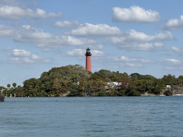 The red Jupiter Inlet Lighthouse on the water north of West Palm Beach