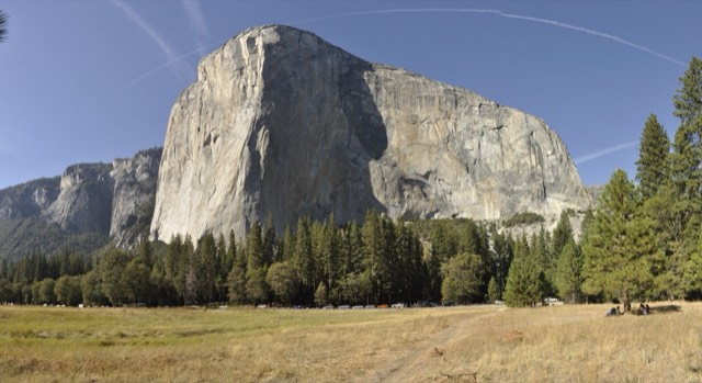 The granite monolith of El Capitan rising above the Yosemite Valley meadows