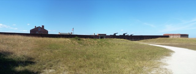 The brick ramparts and cannons of Fort Clinch State Park under a blue sky on Amelia Island