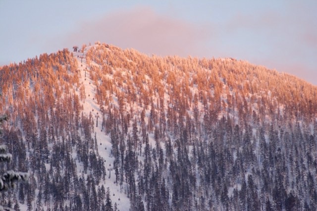 Alpenglow light on the summit of Heavenly Mountain Resort above Lake Tahoe.