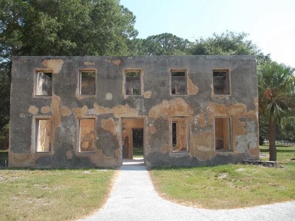The two-story tabby ruins of the 18th-century Horton House under a bright blue sky