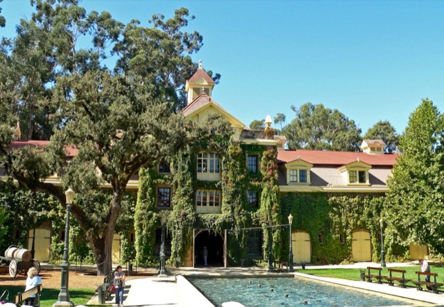 The ivy-clad historic Inglenook chateau winery with its cupola and reflecting fountain in Rutherford