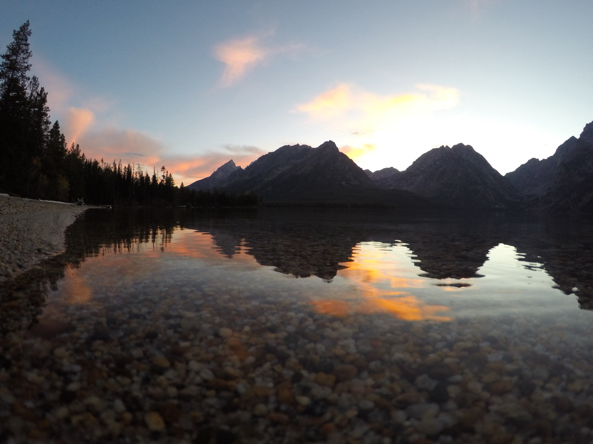 Mount Moran silhouetted at sunset over Leigh Lake