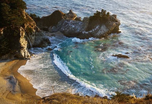 McWay Falls dropping onto the sheltered cove beach at Julia Pfeiffer Burns State Park