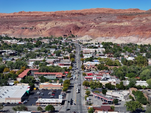 Downtown Moab's Main Street nestled below the red-rock cliffs