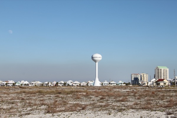 The Navarre Beach water tower over the white-sand barrier island