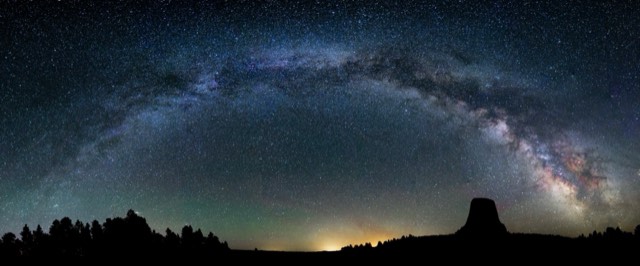 The Milky Way arching over the silhouette of Devils Tower
