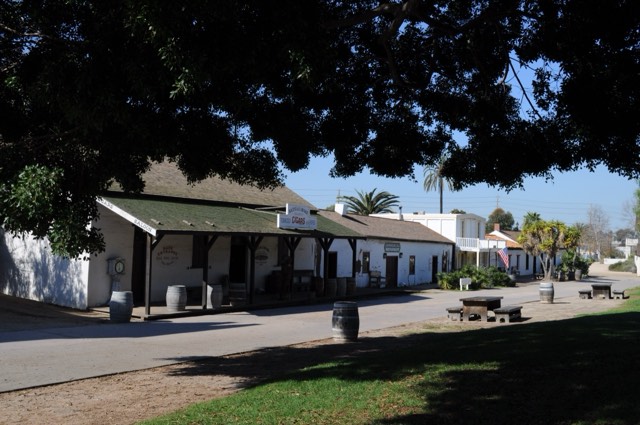 The whitewashed adobe storefronts along the plaza at Old Town San Diego State Historic Park