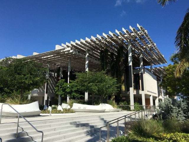 The slatted concrete canopy and hanging vertical gardens of the Perez Art Museum Miami exterior above its terrace and steps