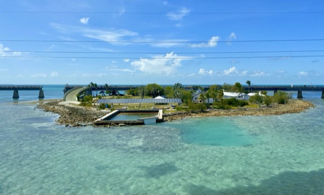 Historic Pigeon Key and the old Seven Mile Bridge curving over turquoise Keys water