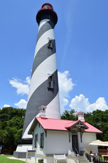 The black-and-white spiral St. Augustine Lighthouse and its red-roofed keeper's house