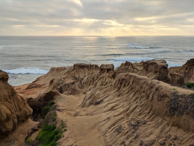 The layered sandstone bluffs of Sunset Cliffs Natural Park dropping to the Pacific at Point Loma