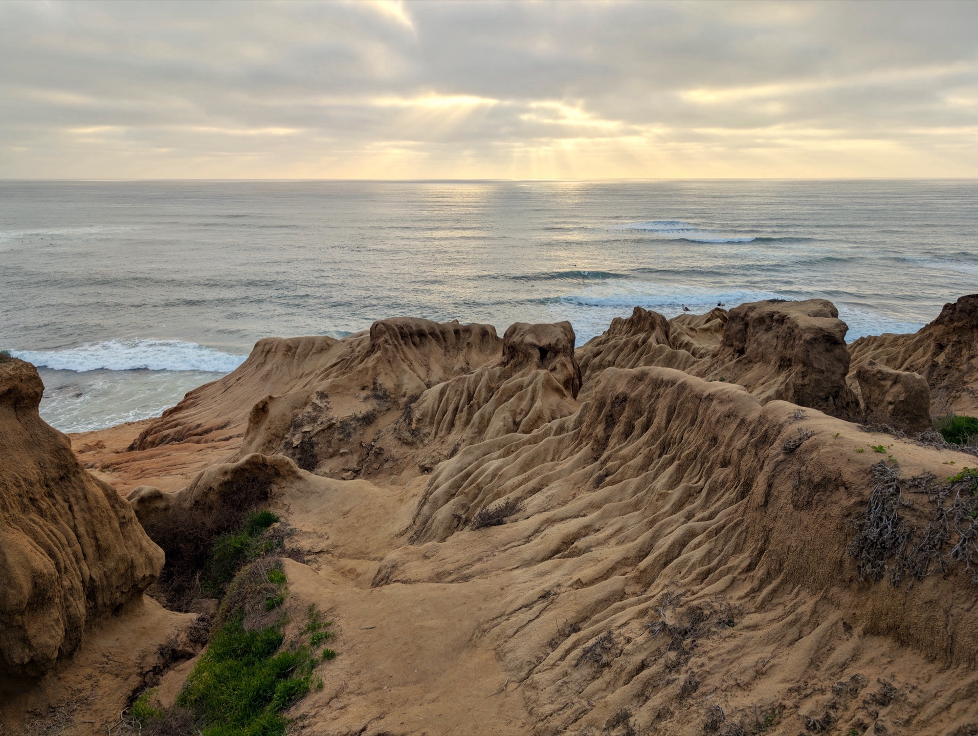 The layered sandstone bluffs of Sunset Cliffs Natural Park dropping to the Pacific at Point Loma