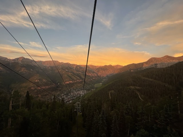 A golden-hour view over the town of Telluride from the free gondola