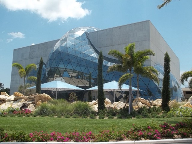 The mirrored geodesic 'Enigma' bubble bulging from the concrete cube of The Dali Museum in St. Petersburg