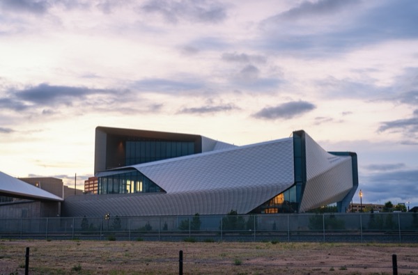 The angular exterior of the U.S. Olympic & Paralympic Museum at dusk in Colorado Springs