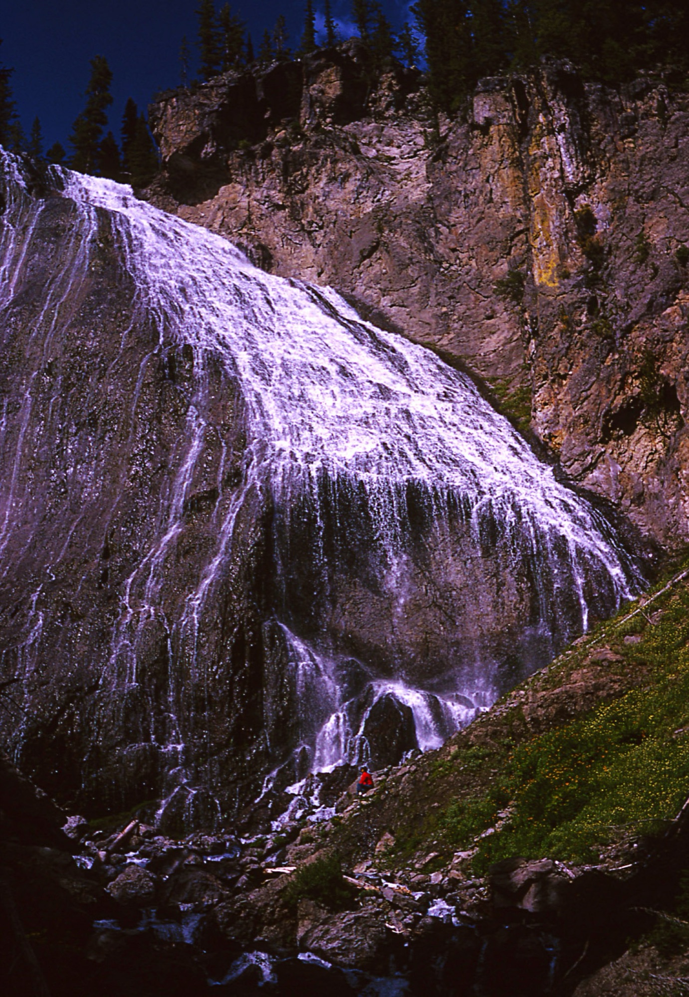 Ouzel Falls tumbling down the cliff in the Wild Basin area