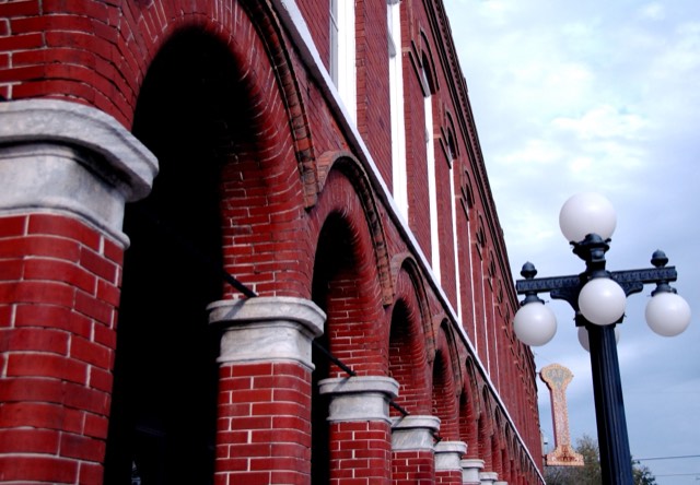 Red-brick historic architecture and a five-globe streetlamp in Tampa's Ybor City