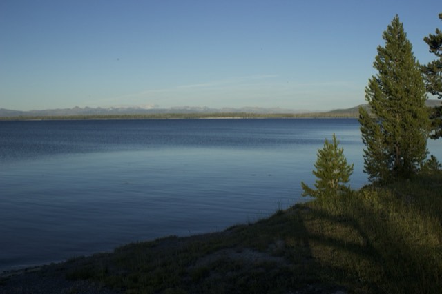 Calm Yellowstone Lake with distant mountains