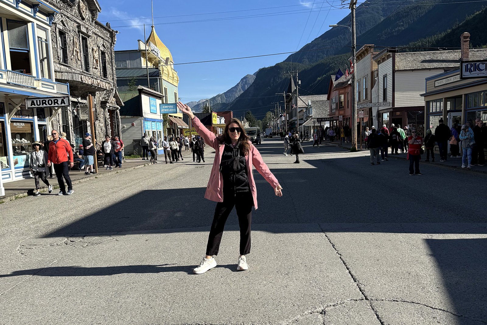 Downtown Skagway's historic Broadway lined with colorful gold-rush storefronts, mountains at the end of the street