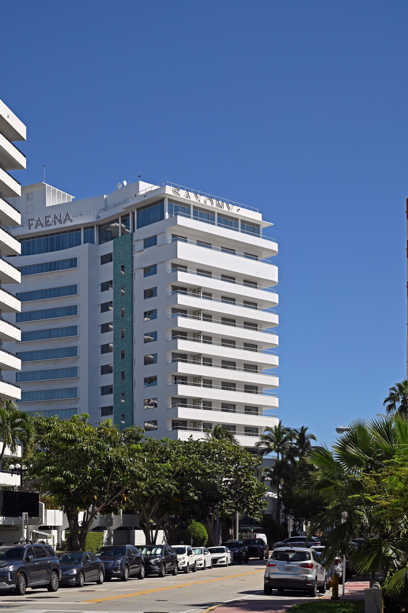 The Faena Hotel Miami Beach — the restored white Saxony building with its rooftop FAENA lettering on Mid-Beach's Collins Avenue