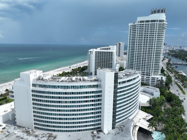 An aerial view of the curved Morris Lapidus Fontainebleau resort tower on the Miami Beach oceanfront