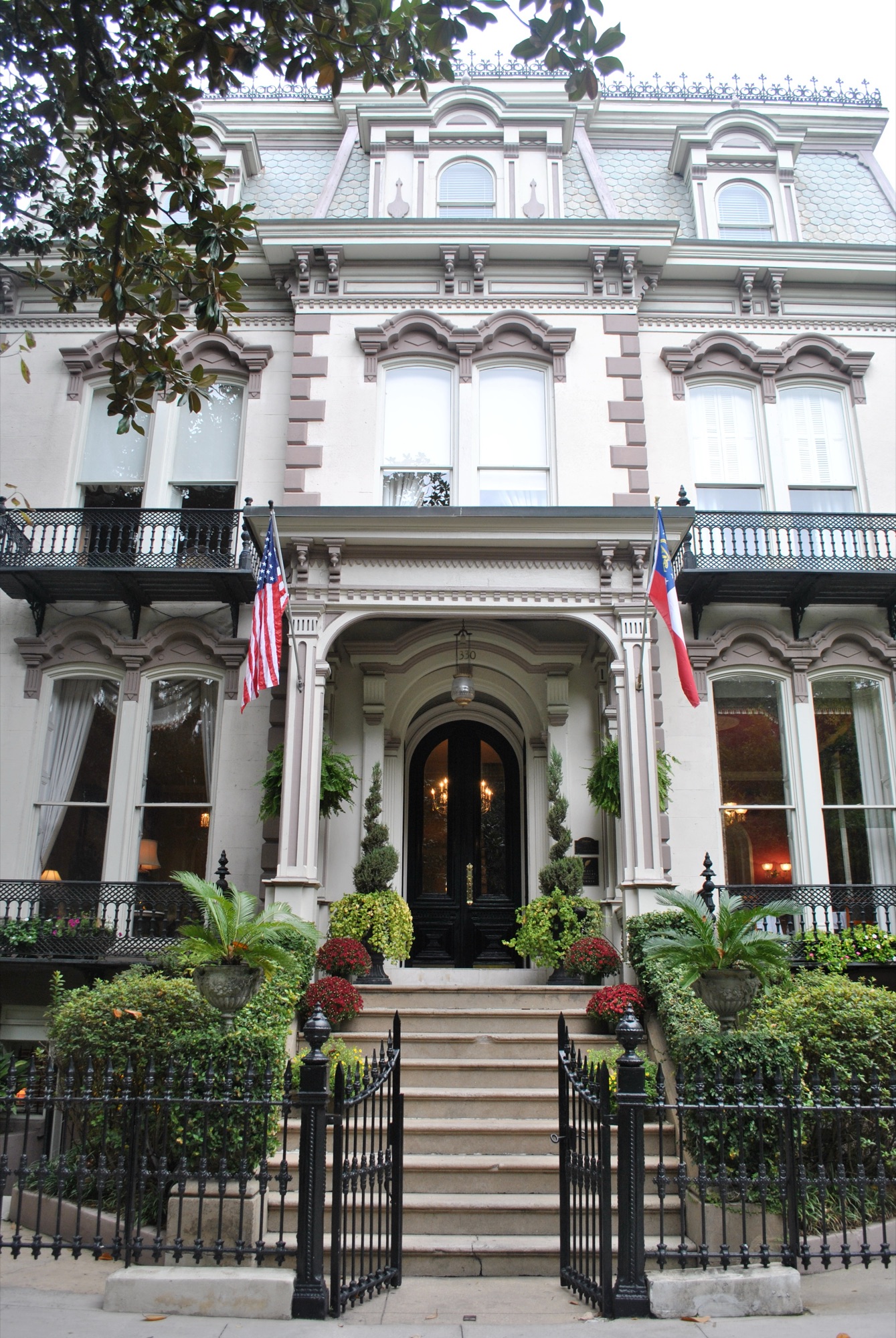 The Hamilton-Turner Inn — an ornate 1873 Second Empire mansion with mansard roof and iron balconies on Lafayette Square, Savannah