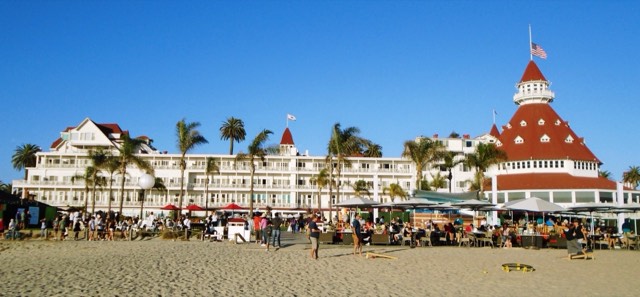 The red-roofed Victorian towers of the Hotel del Coronado seen from Coronado Beach