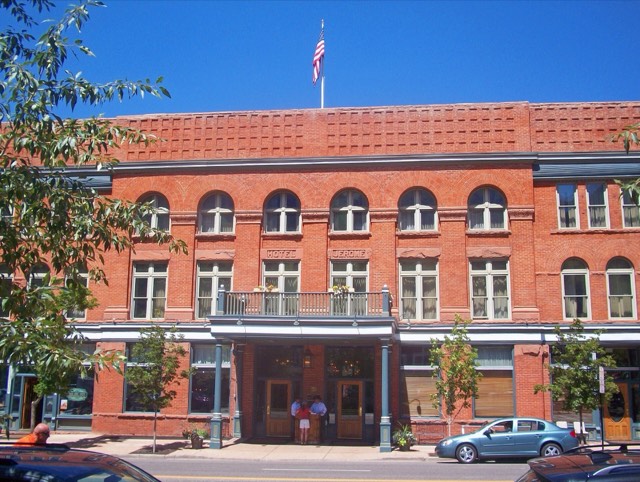 The red-brick facade of the historic 1889 Hotel Jerome in downtown Aspen