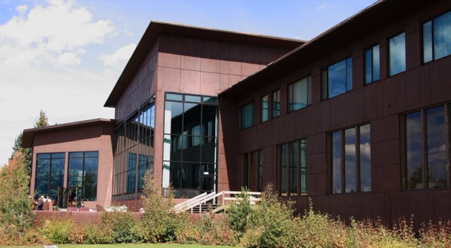 The Jackson Lake Lodge exterior with its tall window walls on a bright afternoon