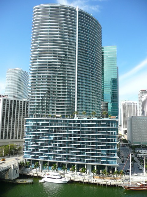 The Kimpton EPIC Hotel's curved twin towers on the Miami River, with the hotel marina below