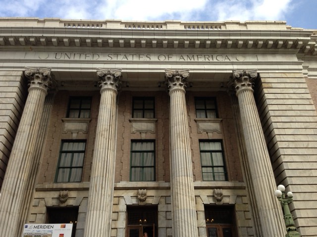 Le Méridien Tampa — the towering Corinthian columns and 'United States of America' cornice of the restored 1905 Beaux-Arts federal courthouse that houses the hotel
