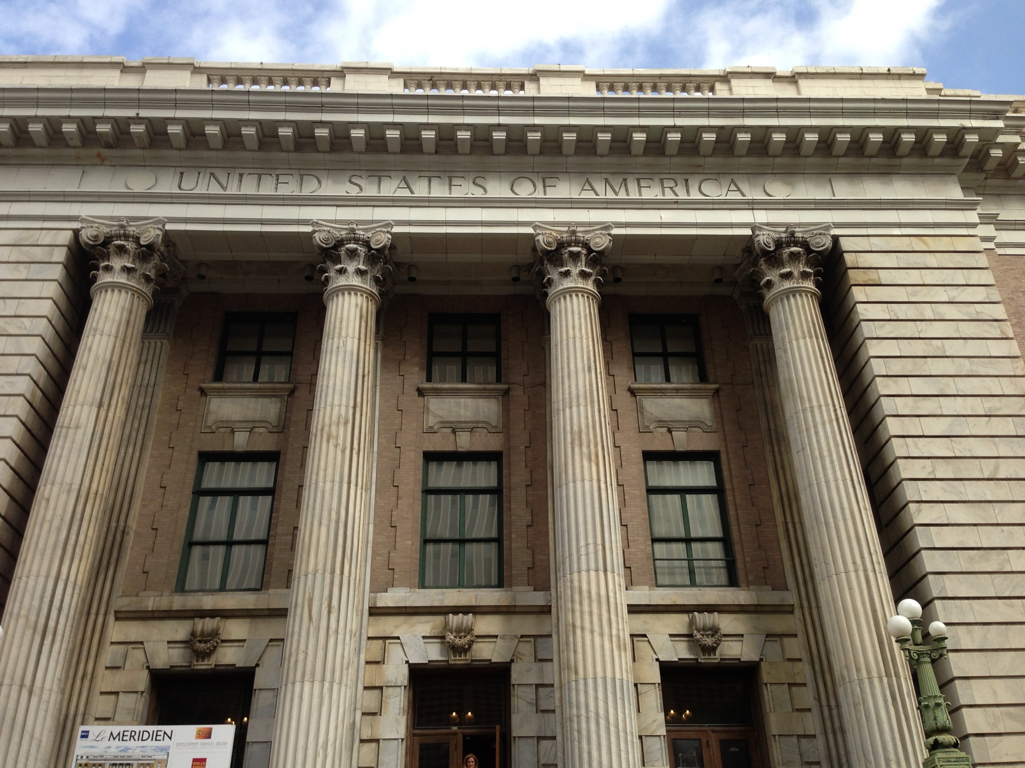 Le Méridien Tampa — the towering Corinthian columns and 'United States of America' cornice of the restored 1905 Beaux-Arts federal courthouse that houses the hotel