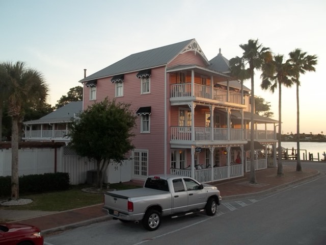 The pink Victorian Riverview Hotel with its white porches on the New Smyrna Beach riverfront