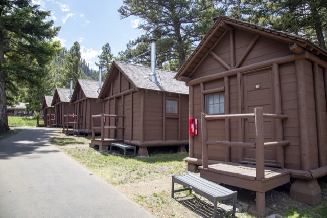 Rustic log Roughrider cabins at Roosevelt Lodge