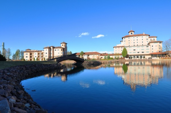 The pink Italian-Renaissance Broadmoor resort reflected in Cheyenne Lake