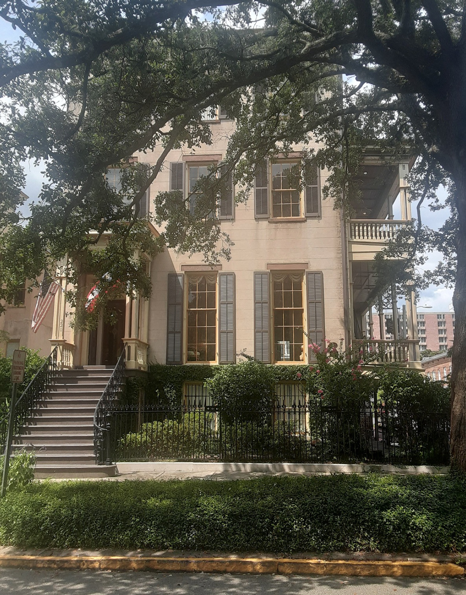 The Gastonian — the historic Robert Footman House, a stucco Savannah mansion framed by a moss-draped live oak on Gaston Street
