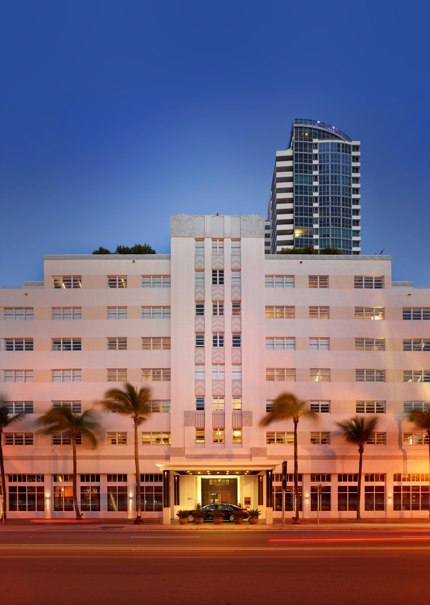 The Setai, Miami Beach — its restored 1930s Art Deco building at dusk on Collins Avenue, the tower rising behind