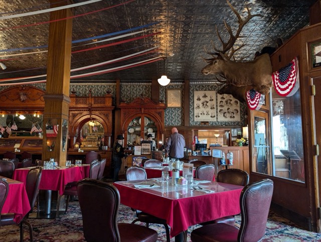 The Irma Hotel's historic dining room with its cherrywood bar and pressed-tin ceiling