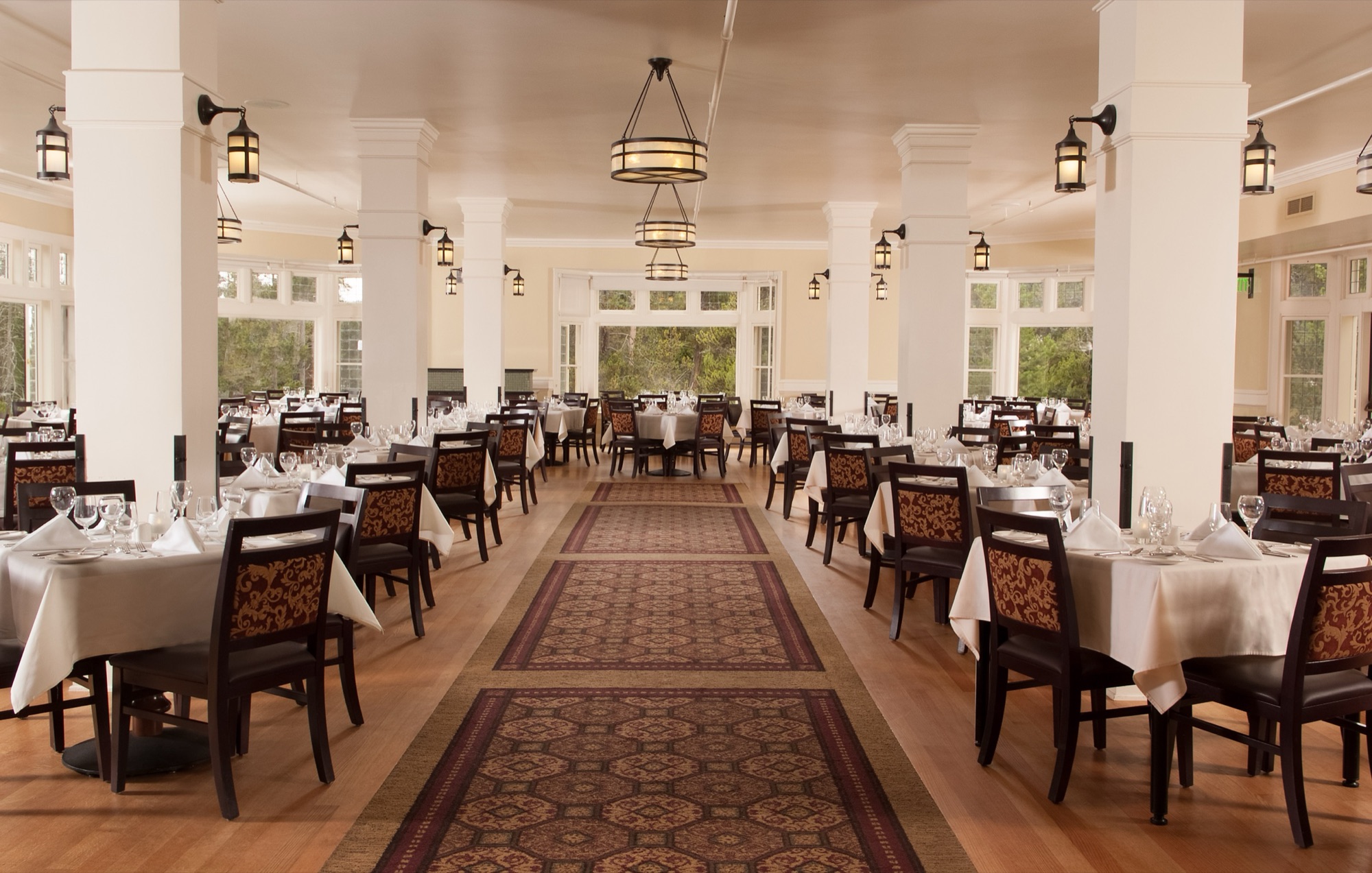 The elegant white-columned dining room of the Lake Yellowstone Hotel